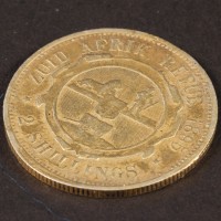 Van Pelt (Jonathan Hyde) gold coin