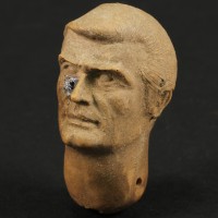 Production made James Bond (Roger Moore) puppet head